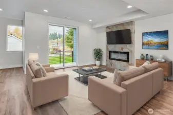 Welcoming living area on main level with electric fireplace. Virtually staged.