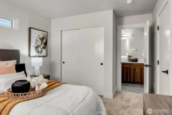 Ground level bedroom leads to bathroom.