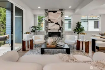 Statement fireplace is the focal point of this living area