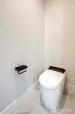 Smart toilet in primary bath with bidet and heated seat