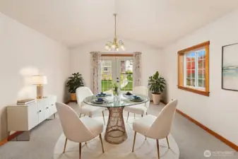 French doors lead you from the kitchen to fenced backyard. *Virtually staged*