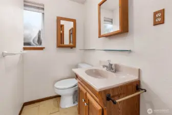 Half bathroom in primary suite.