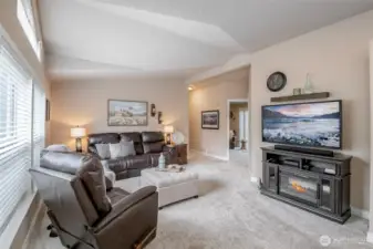 Plush carpet under foot & soaring ceilings overhead are drenched by the natural light.