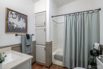 Full hall bath with plenty of space and storage.