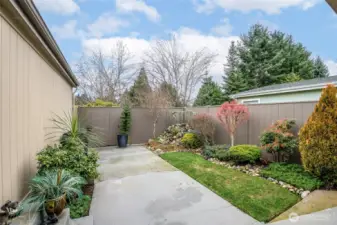 Fenced for privacy and acts as a buffer with access to separate back yard space.