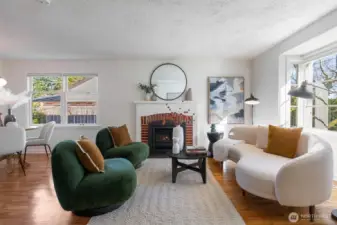 Spacious and sun-filled living room with gas fireplace