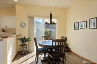 Open dining area with sliding doors to the patio.