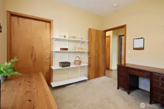 The door on the left is a walk-in closet in the guest bedroom.