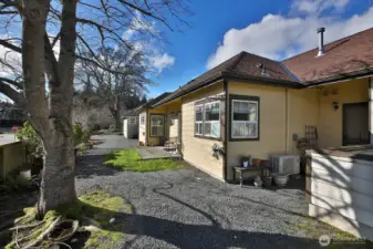 The backyard has a door into the garage.