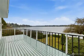 Wonderful oversized deck looking over the lake.