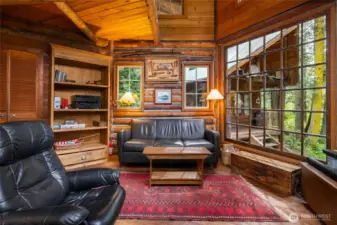 Logs make up all the walls and floors are fir