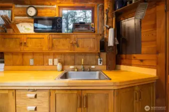 kitchen has lots of sizes of cupboards for your various needs.