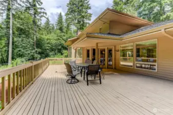 Huge deck off kitchen overlooking sprawling backyard