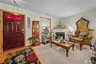 Looking back toward the front door and sitting area with the fireplace.