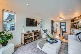 The living room is opened to the kitchen on the upper level.