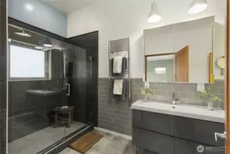 Modern ensuite bathroom with walk-in shower and elegant finishes.