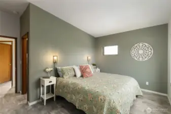 Spacious primary bedroom layout emphasizes restfulness and connection to the outdoors.