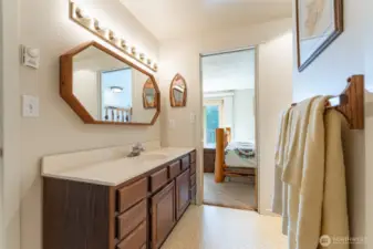 Full bathroom upstairs is connected to the primary bedroom with an additional door to the hallway.