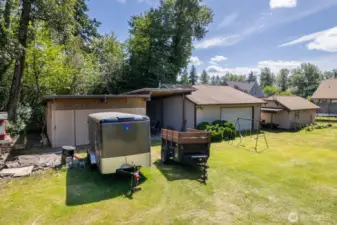Huge back yard, with plenty of parking for toys and accessories. Storage area, RV parking, shop and Shed