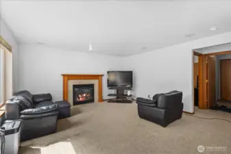 Large family room with gas fireplace.