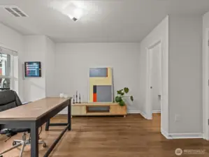 Ground level open room is perfect for a home office or flex space.