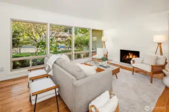Beautiful brick fireplace wall and huge span of windows to watch the sunrise.