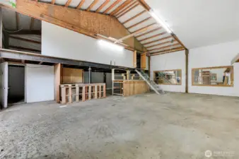 The second section of the shop is sheet rocked with the loft.