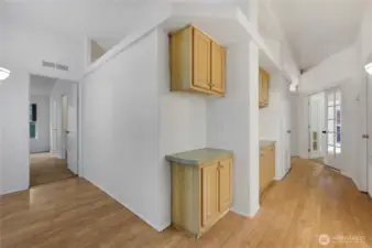 The wide hallway also has lots of built in storage.