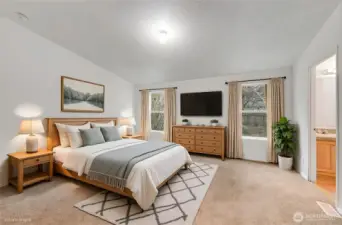 The primary suite is a wonderful retreat. It is virtually staged.