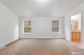 The primary suite not staged. The carpet in both bedrooms, office and bonus rooms all have new carpet.