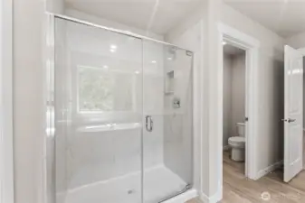 Marble surround in shower. Photo's are for representational purposes only. Colors and finishes may differ.