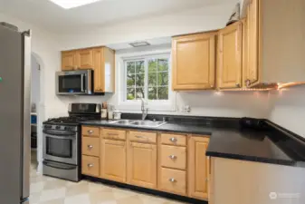 Updated kitchen with stylish cabinets and SS appliances.