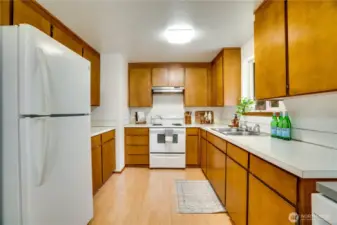 Kitchen cabinets and appliance function well and are in good condition