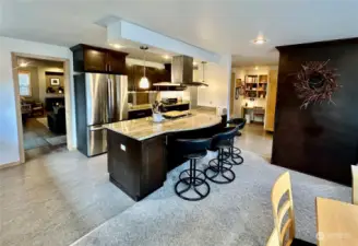 Another view of kitchen, entrance to living room, dining room to the right.