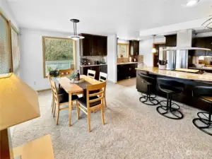 View of dining area with and kitchen.