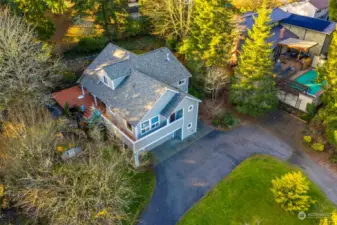 Surrounded by trees and mature landscaping making for a private setting.  Access to deck and yard from both kitchen dining, living and primary suite.