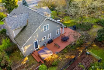 Deck and fully fenced yard is accessible from living and kitchen dining area.