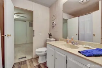 Full guest bathroom has access door from utility room or guest bedroom.