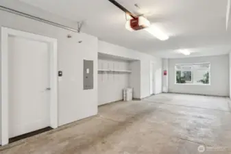 Tandem 2-car garage with a large window at the end, perfect for a workout area