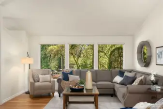 High ceilings and spacious living room flooded with light.