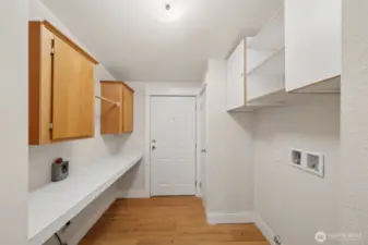 Utility Room offers extra storage and folding area.