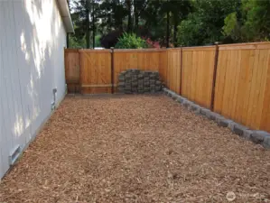 Another view of the fenced side yard.