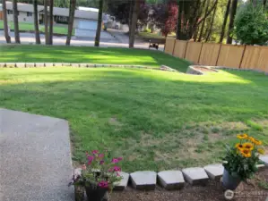 Emerald lawns (from the front door looking out, driveway to the left of the walkway)