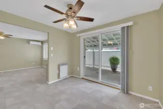 Dining room off kitchen with slider to covered patio.