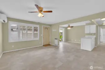 Living room with ceiling fan and mini split to stay warm in the winter and cool in the summer.