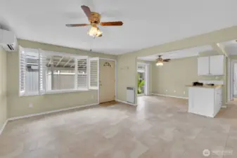Living room with the faux wood shutter blinds open.