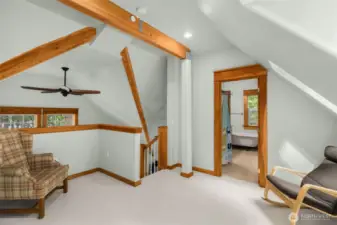 Elegant wood beams bring warmth and character to upper level.