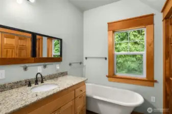 The Primary en-suite bath includes tiled shower and classic clawfoot tub.