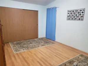 Spacious Primary Master Bedroom with Cathedral Ceilings, Full Wall Closet and Laminate Flooring.