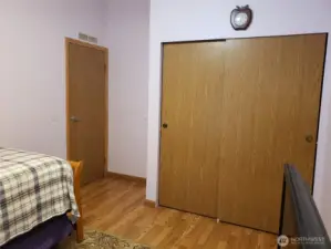 Another View of the Good Size Second Bedroom with Laminate Flooring and Large Closet.